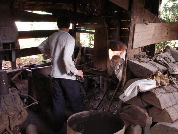 Blacksmith going about his business