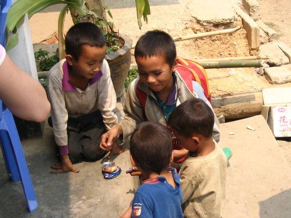 kids fighting over a tin can