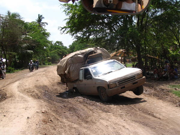 Car stuck in mud in villages around Battambang