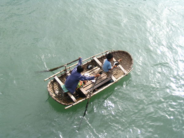 Vietnamese kids playing sailor in boat