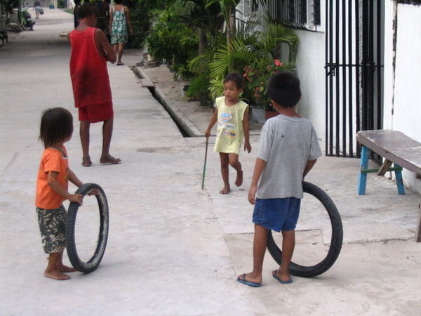 kids playing an elaborate game with tyres