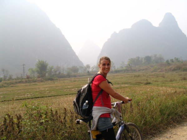 Donna in the hazy countryside surrounding Yangshuo