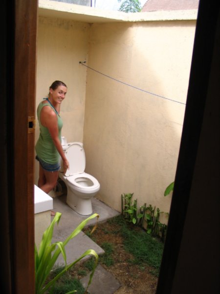 Donna modelling the outside toilet...