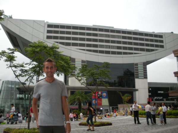 Neil in front of the big shopping centre at the Peak
