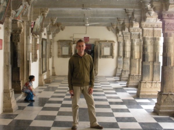 Neil doing pose in palace corridor
