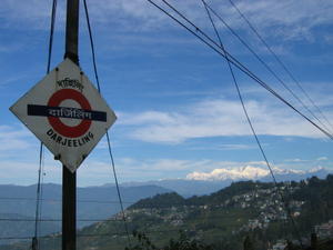 toy train station with darjeeling and mountains behind