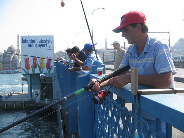 fishing off a bridge into the Bosphorus, Istanbul