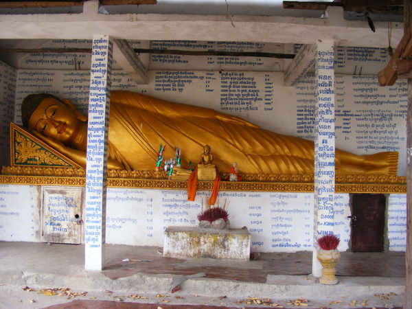 Buddha reclining in a bus shelter