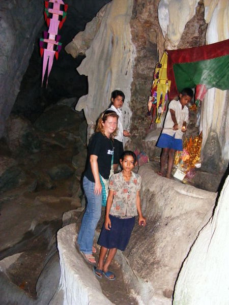 With friendly kids at cave shrine near Kampot