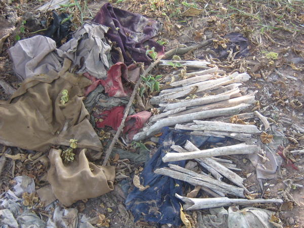 The clothes and bones of small children are displayed in testament to the events here