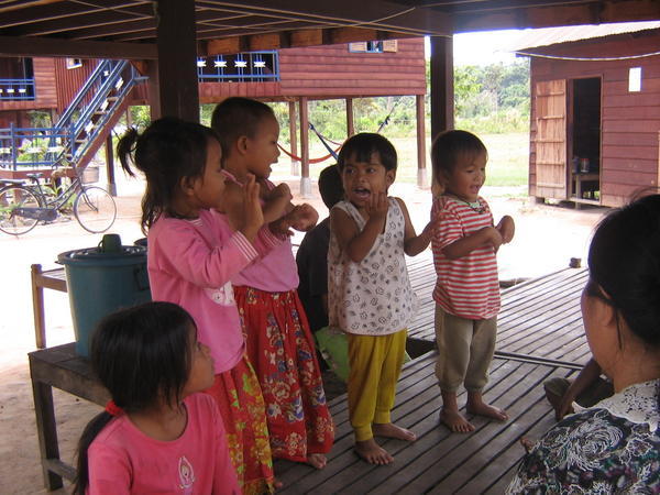 The girls practice traditional Khmer dance