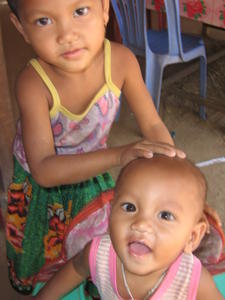 Cute Khmer kids kept me company at lunch