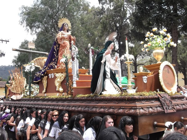 Statue of the Virgin Mary being carried by the women.