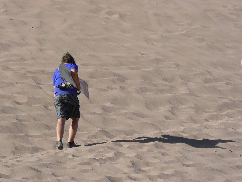 Walking up sand dune
