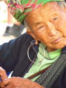An Old Hmong Lady Sells her Wares