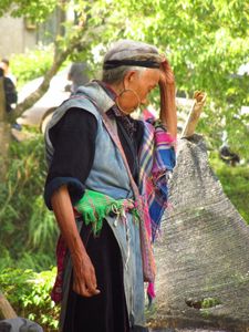 A Hmong Lady fixes her hair