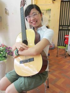 Tsing with her guitar