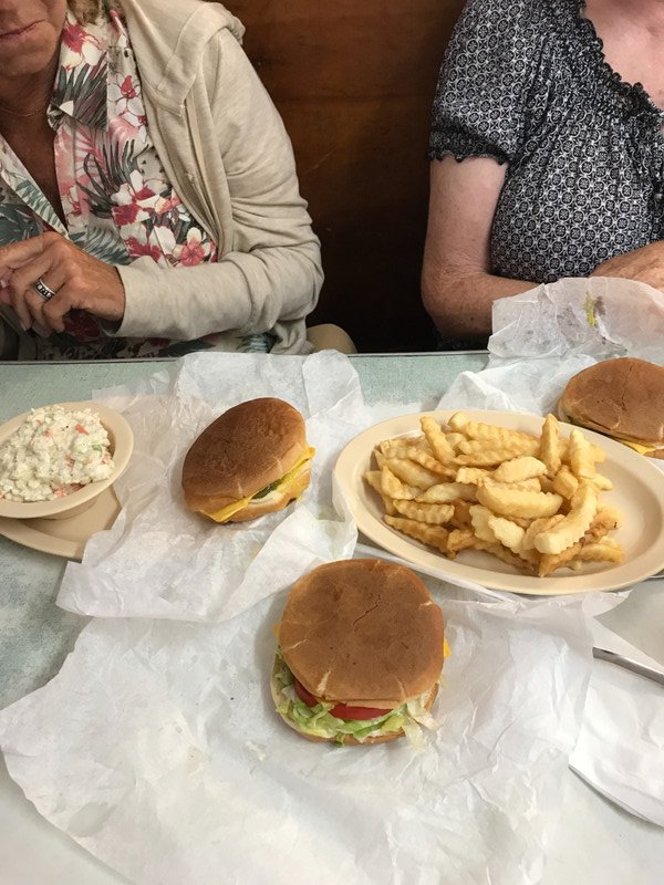 3 burgers, 3 drinks, fries, cole slaw, $18
