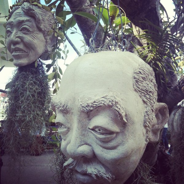 Heads hanging from trees