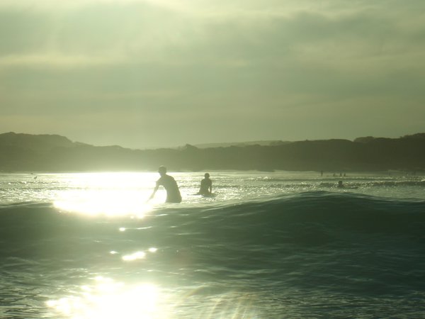 Surfing as the sunsets