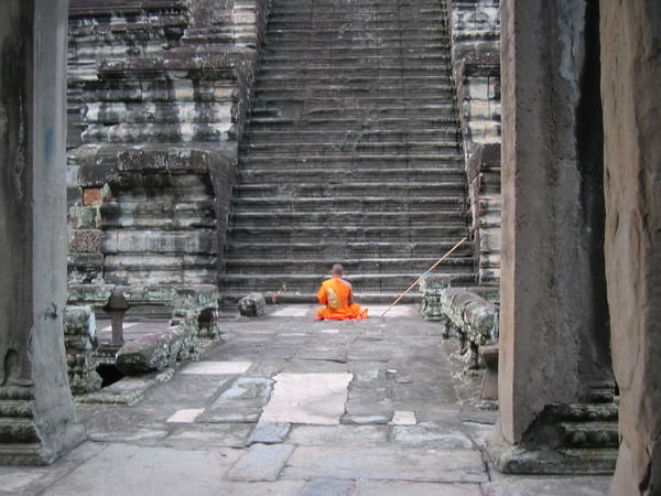 Praying at the Steps to Angkor