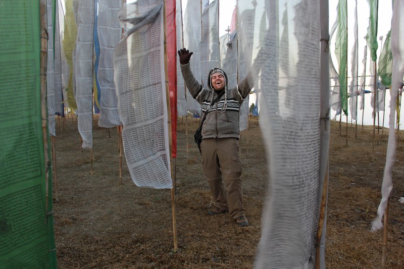 Me with prayer flag at Tiger Hill