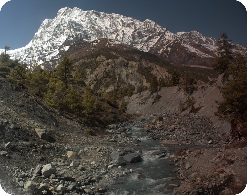 The mighty Annapurna III and a river taken through the lense of my sunglasses