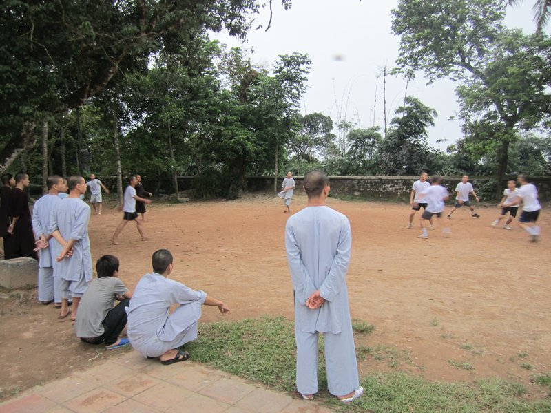 Monks playing footy