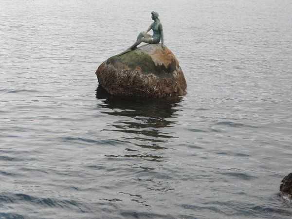 Statue of a girl on a rock