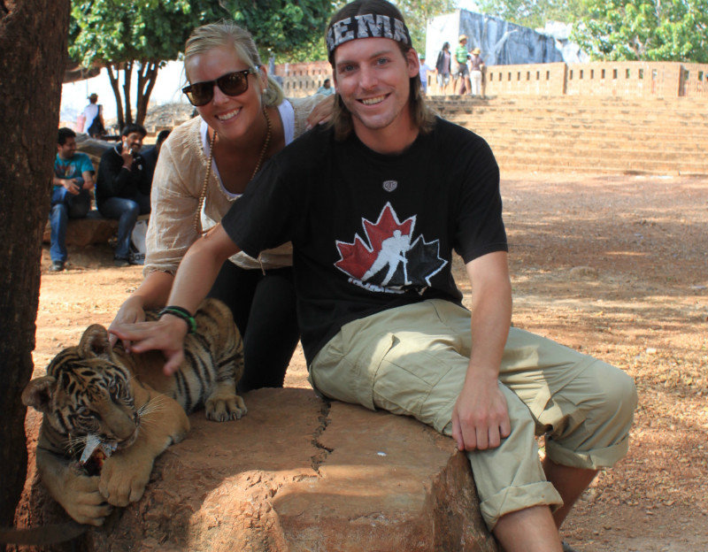 Ty and Becs with a tiger cub
