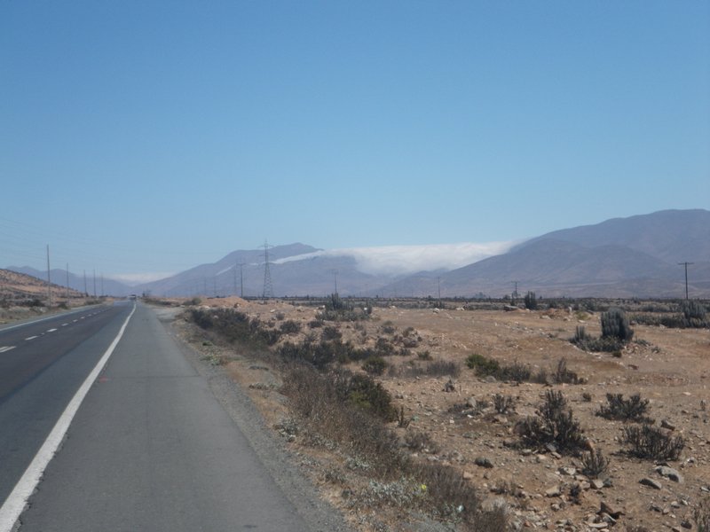 The morning fog lying in the valleys south of Copiapo