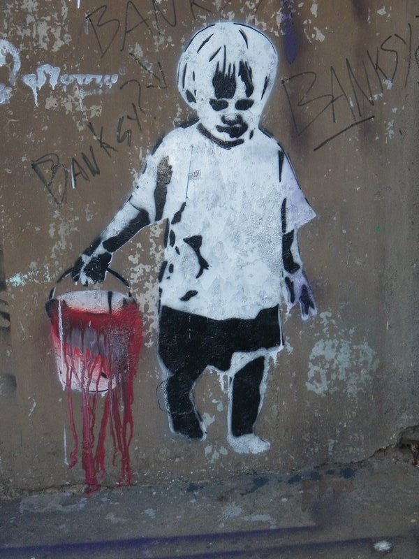 A Banksy on the outside of the Galeria de Arte, Valparaiso