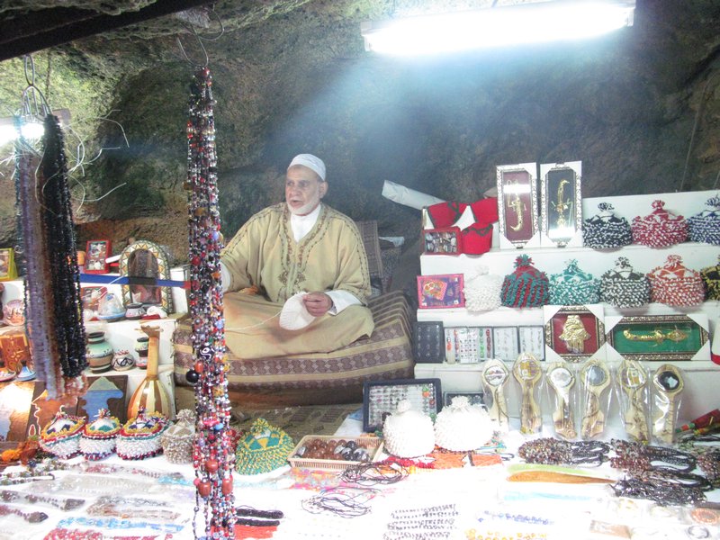 Moroccan selling his wares in Cave Hercules