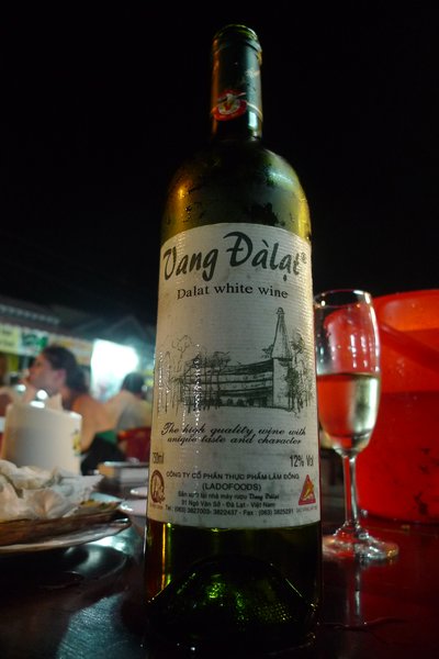 Amazingly good north Vietnamese wine - - a life saver when you are tired of beer! $2.50 at the grocery store, $5 at a restaurant. The white is a lot better than the red.