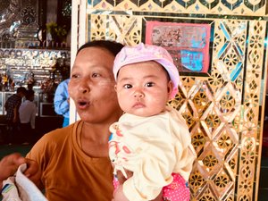 Woman with baby at Warrior Palace, Mandalay