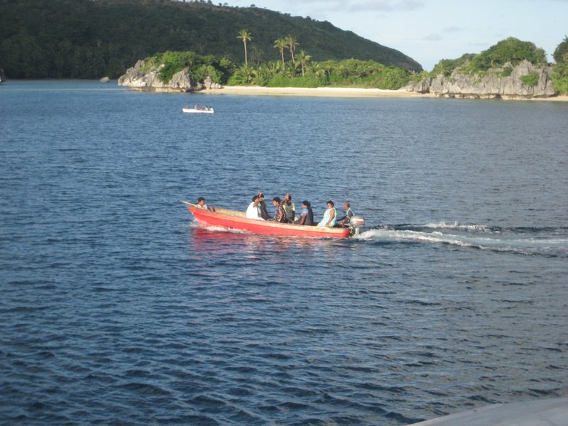 Villagers leaving an island wave at the boat