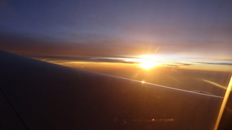 sunrise out the window of the plane