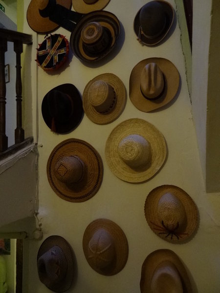 hats on the wall going up the stairs