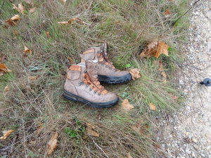 someones retired boots on the track