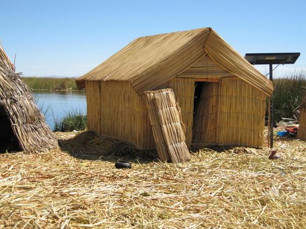 Reed hut on reed island near reed boat