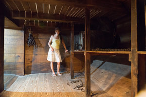 Bonnie inside a replica cargo bay of a slavery ship