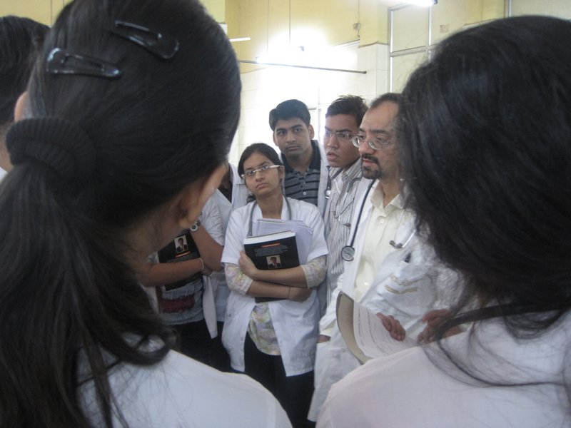 Dr. Karnik on rounds, surrounded by medical students