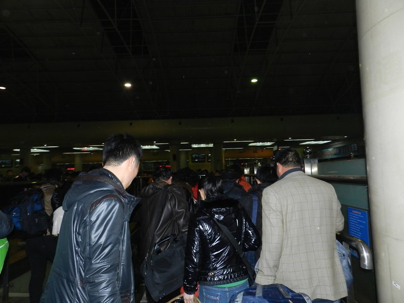 Chinese people entering the train