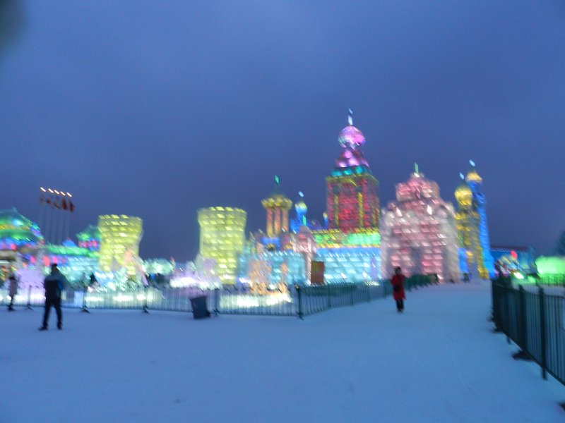 snow and ice land at night with color lights
