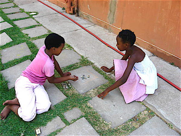 girls playing on the walkway
