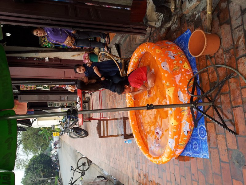 cooling off in streets of luang Prabang