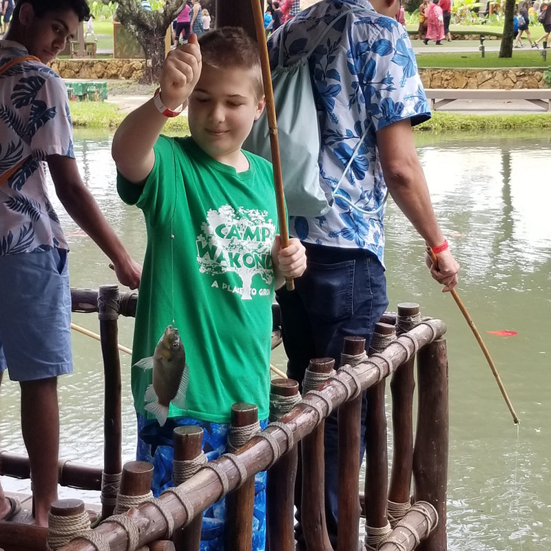 Noah caught a fish at Polynesian Cultural Center