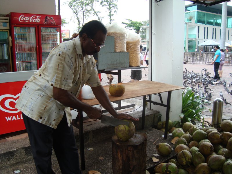 Man Hacking Coconut
