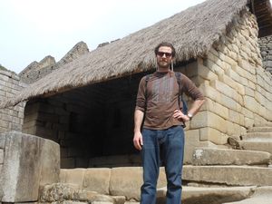In front of one of the ancient dwellings