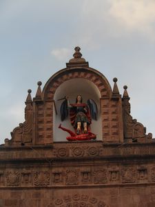 One of the many statues on top of the church